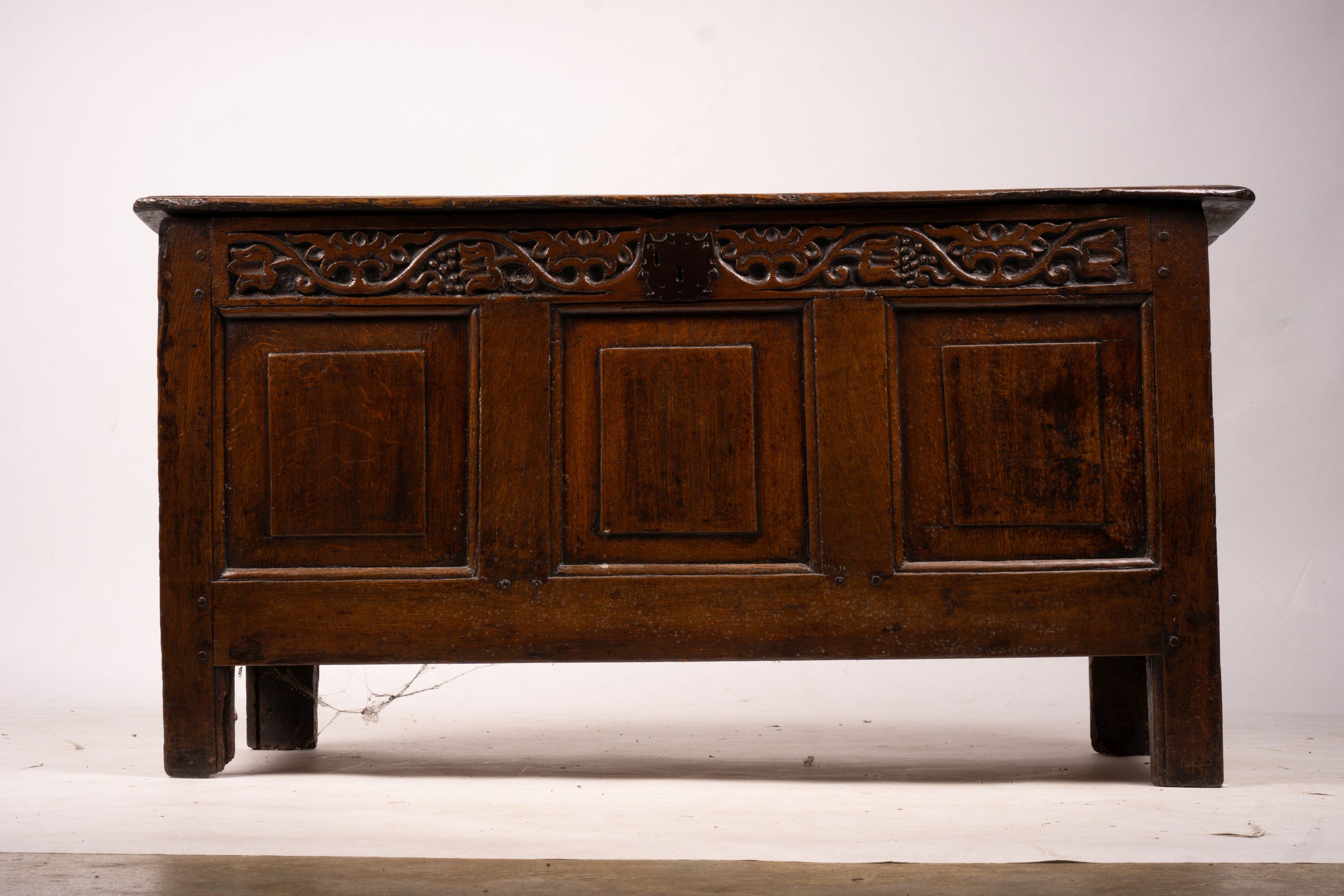 A 17th / 18th century carved oak coffer, length 132cm, depth 53cm, height 64cm